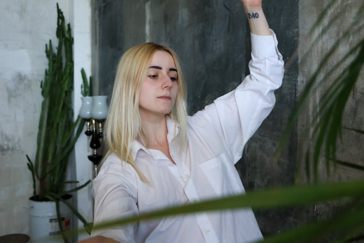 Young Pensive Woman Dancing At Home