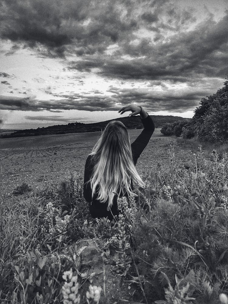 Calm Woman In Field In Countryside