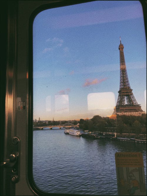 View of the Eiffel Tower from the Glass Window of a Train