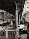 Cars driving under bridge in downtown