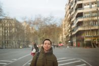 Woman in casual outwear and black short hair on street