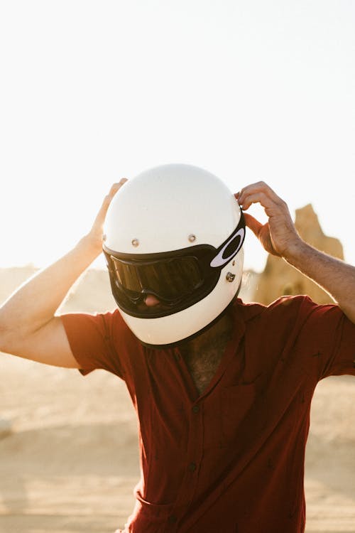 Unrecognizable man in helmet in nature