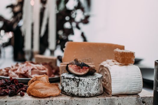 Cheese and dried fruits in store