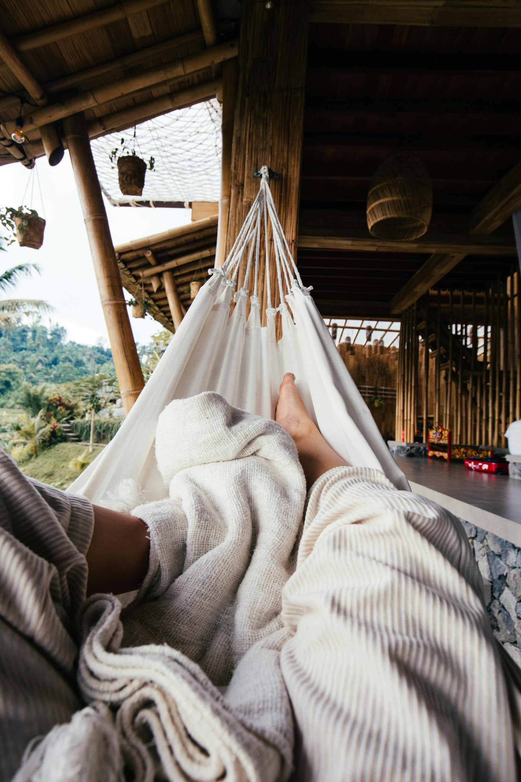 faceless person resting on hammock