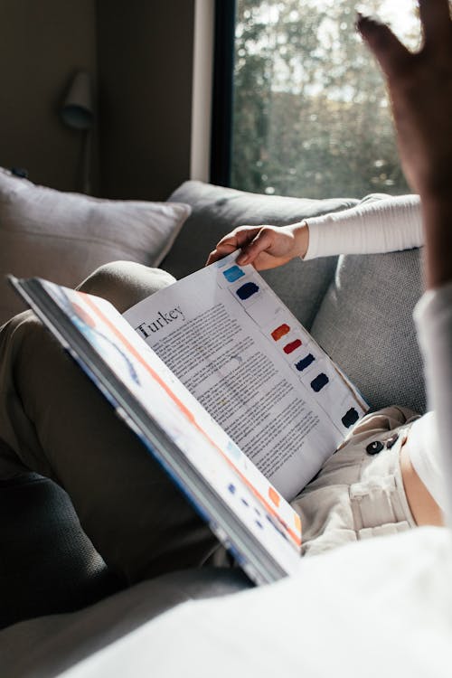 Free A Person Reading a Book Stock Photo