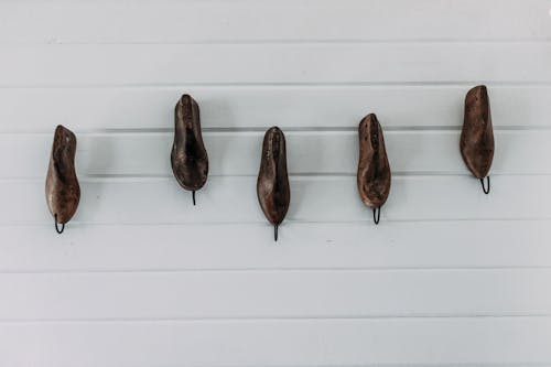 Simple boots on white wall