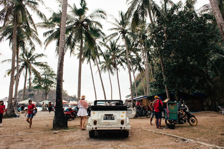 Parked Retro Automobile On Public Beach