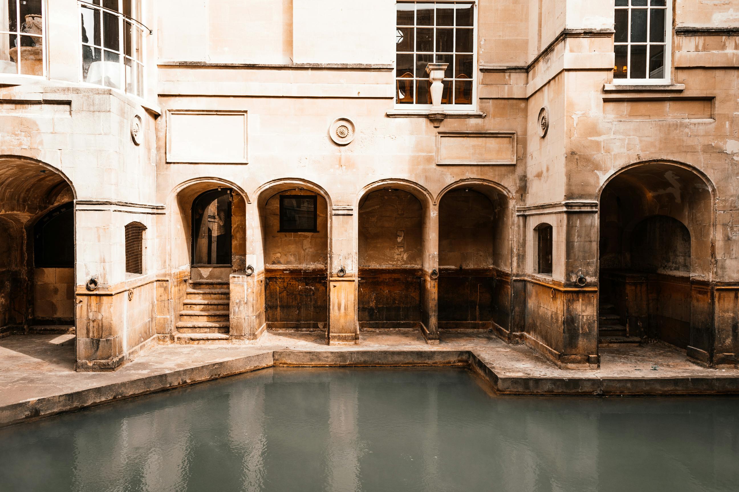 old stone building near water