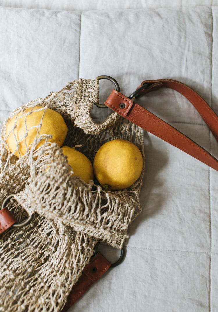 Ripe Quinces In Zero Waste Bag On Soft Blanket