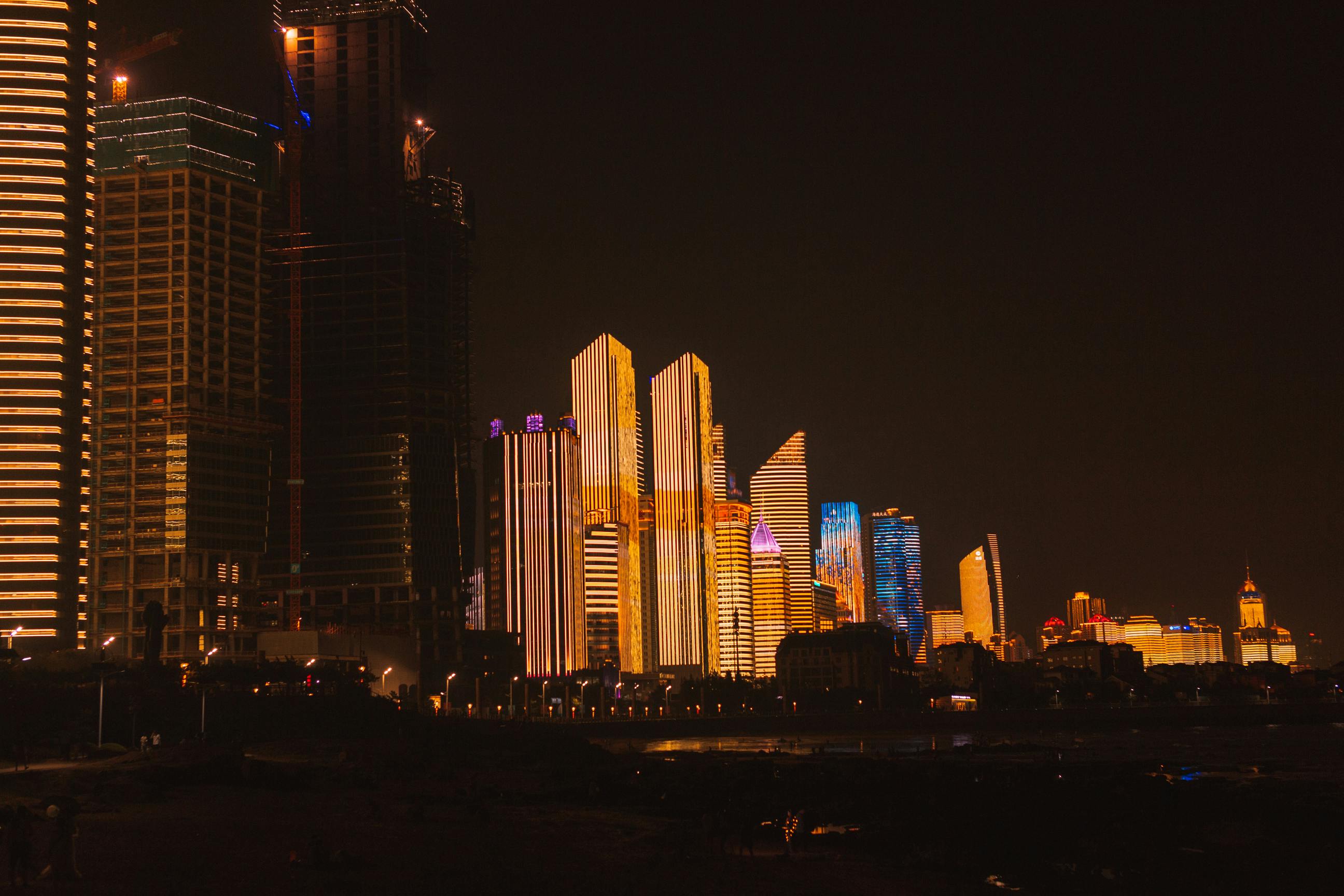 modern megapolis with illuminated architecture at night