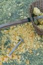 Brown Wooden Handle Gray Metal Stick on Gray and White Stone
