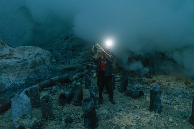 Man With Flashlight On Head