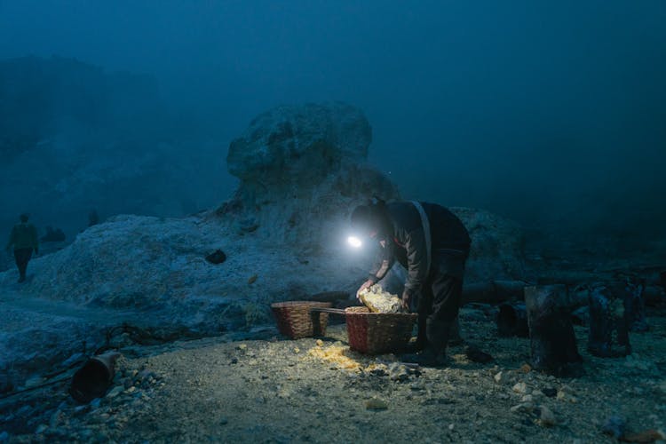 Man Working With Stones At Night