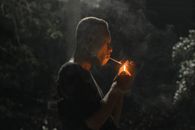 Man in Black Shirt Smoking