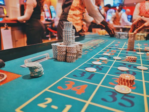 Free People Near Roulette Table in Casino Stock Photo
