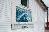 Signboard on cottage with location name Dildo Harbour