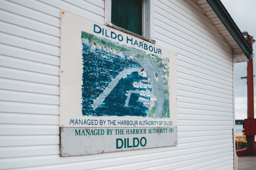 Signboard on cottage with location name Dildo Harbour
