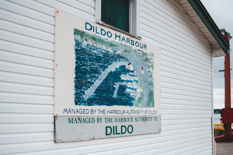 Signboard On Cottage With Location Name Dildo Harbour