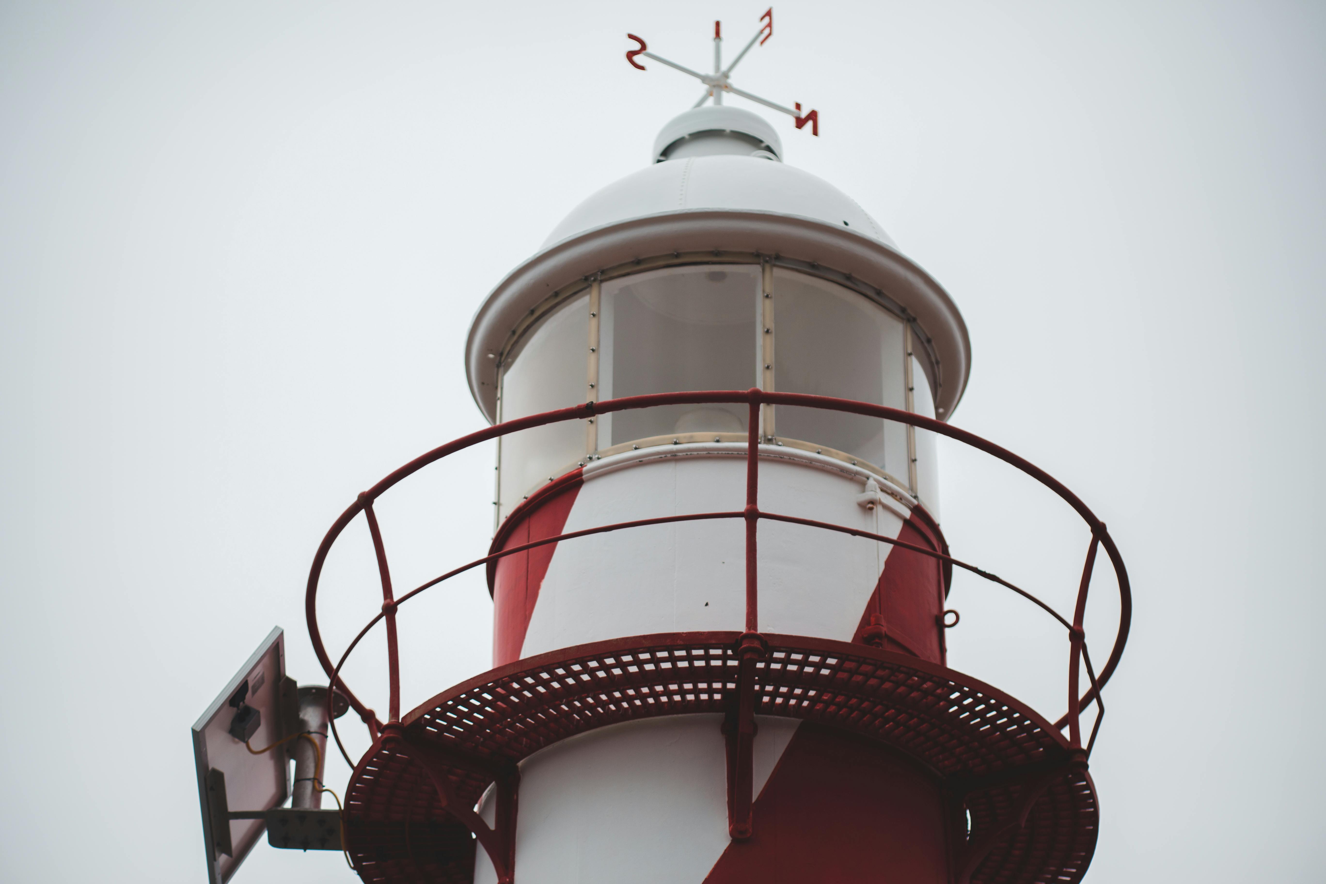 Beacon of lighthouse against cloudy sky · Free Stock Photo