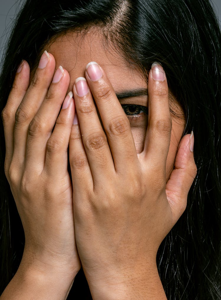 Woman Covering Face With Hands