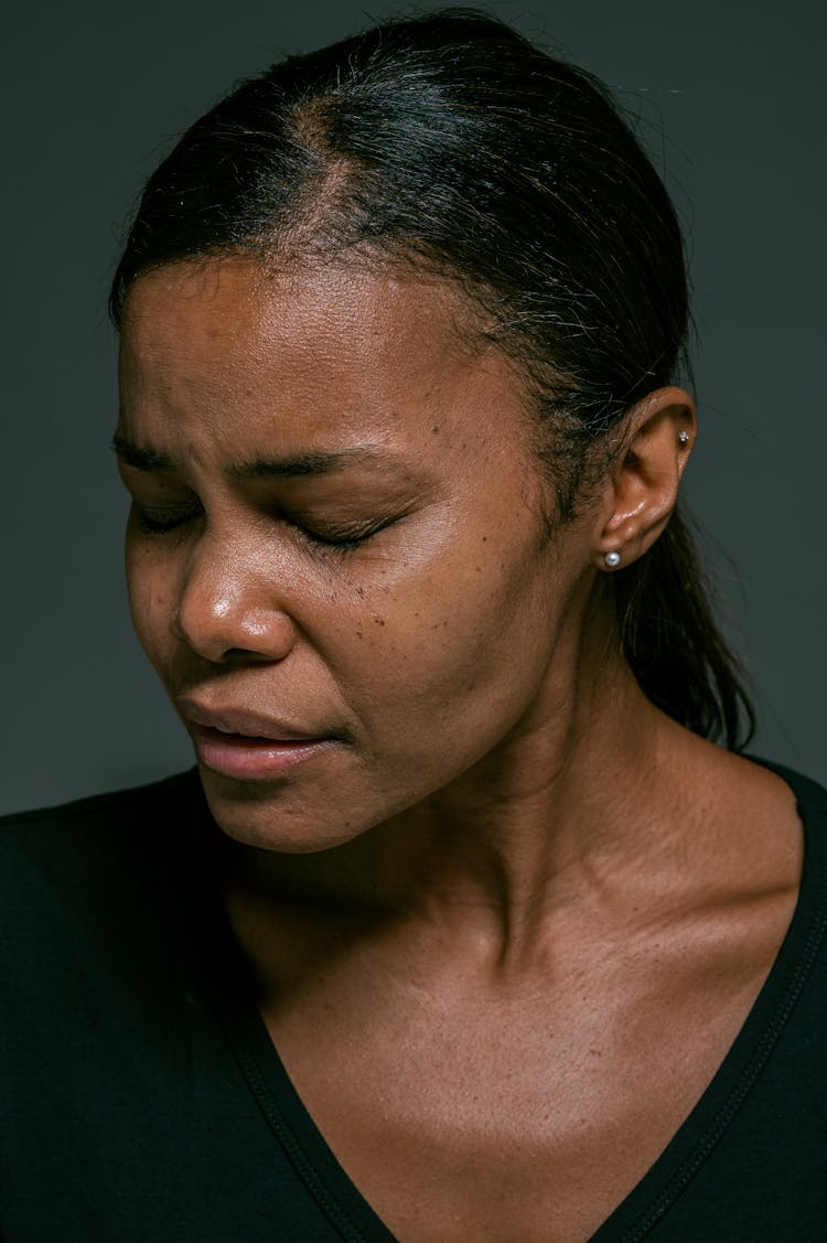 Woman In Black Scoop Neck Shirt With Closed Eyes