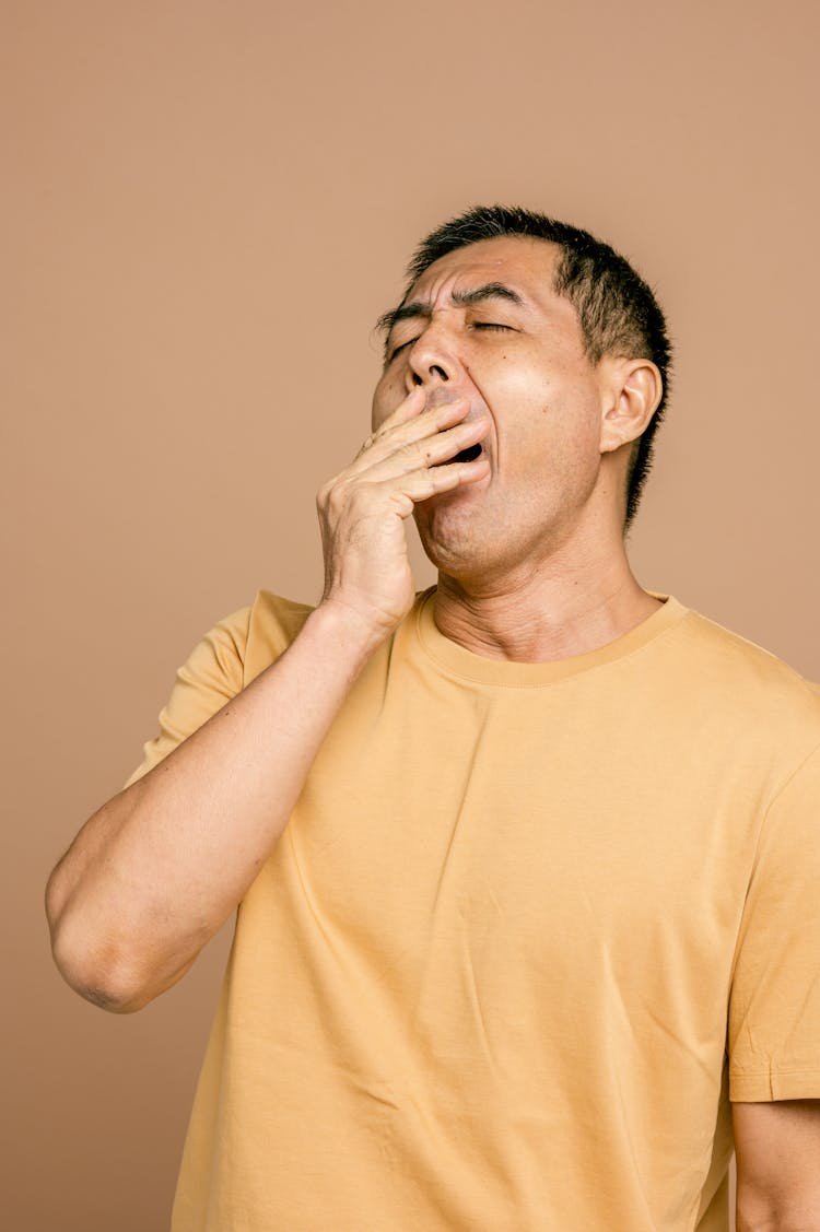 A Sleepy Man In Yellow Crew Neck T-shirt 