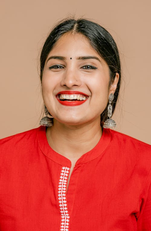 A Woman in Red Shirt Smiling