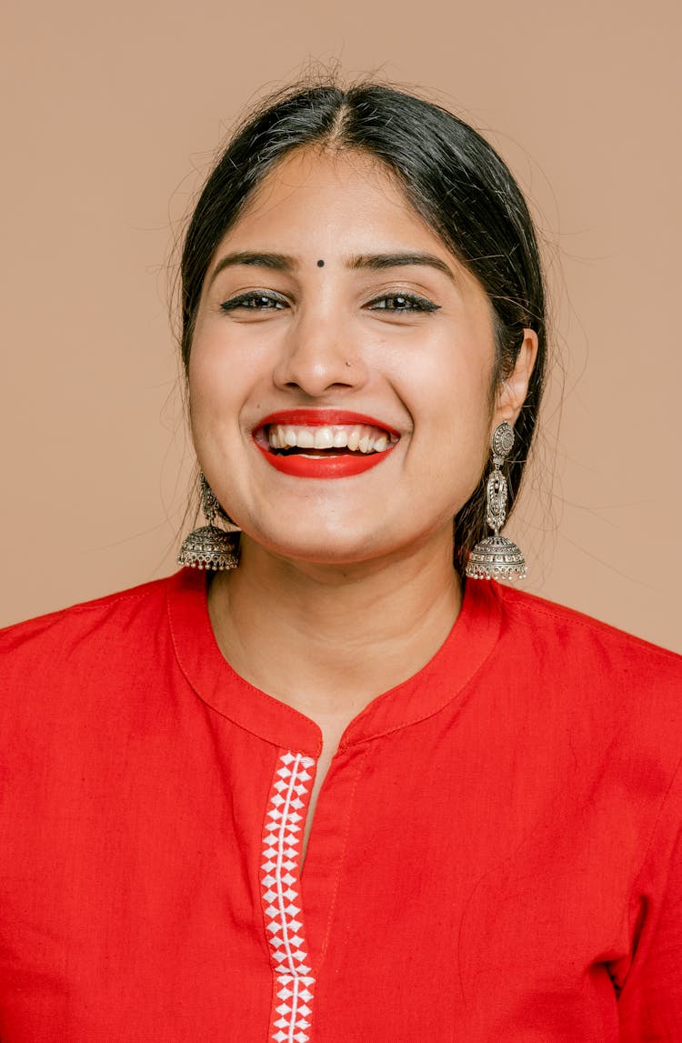 A Woman In Red Shirt Smiling