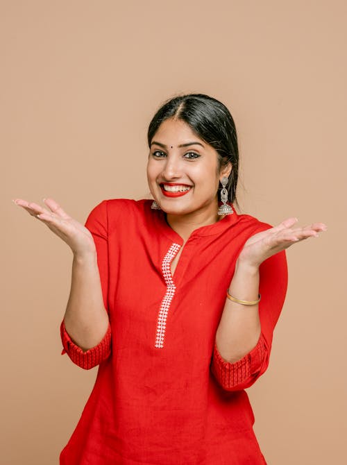 Free Portrait of Happy Woman Wearing Red Blouse Stock Photo