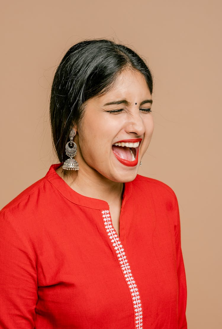 A Woman In Red Dress Screaming