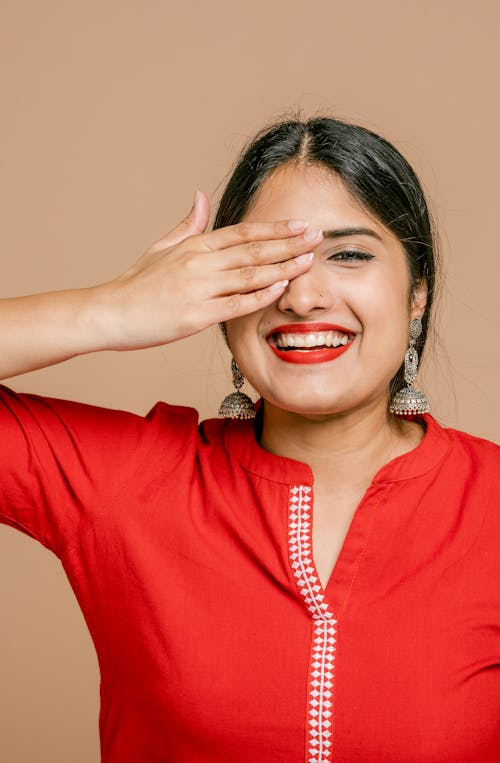 Free Woman Covering an Eye with her Hand Stock Photo