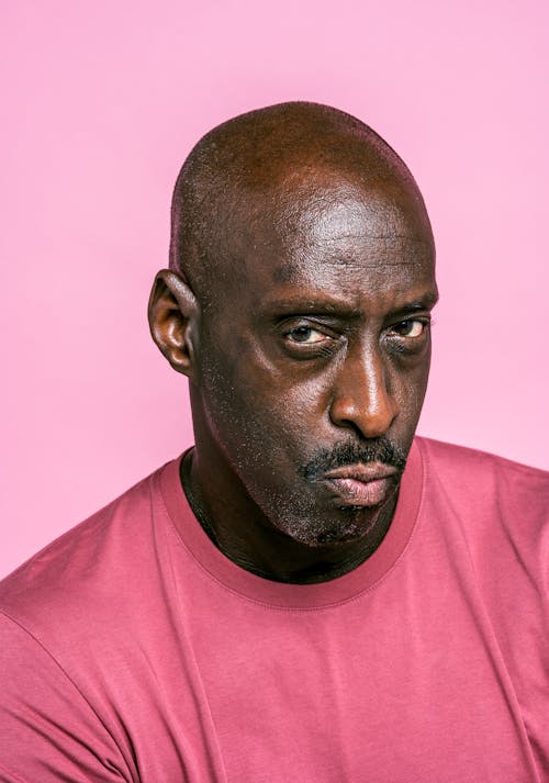 Free Portrait of a Man in Pink Crew Neck Shirt Stock Photo