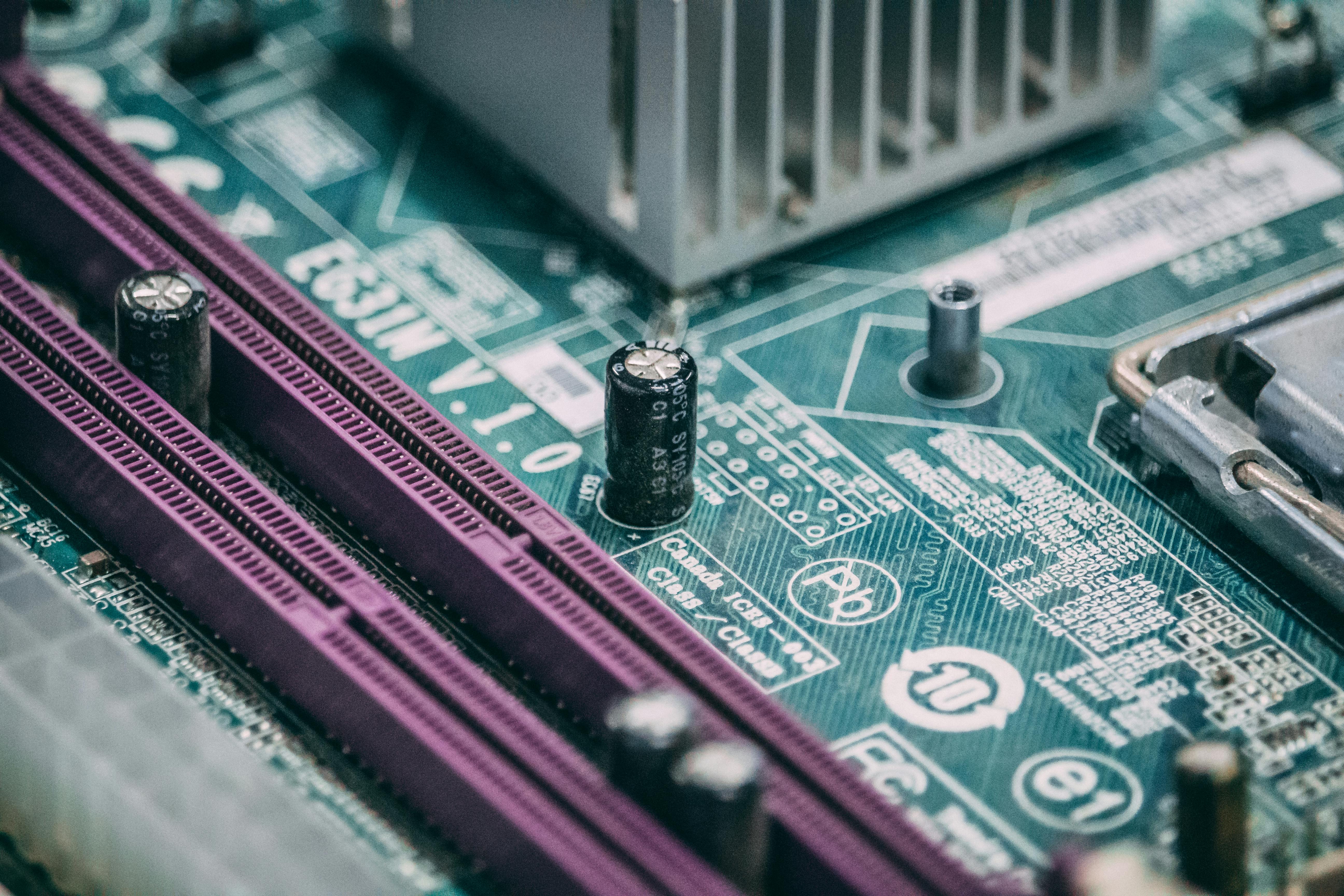 Electronic Capacitor on a Circuit Board · Free Stock Photo