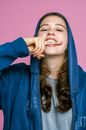 A Girl Biting Her Finger with Shut Up Message