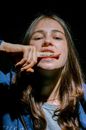 A Young Woman with Shut Up Note on Index Finger