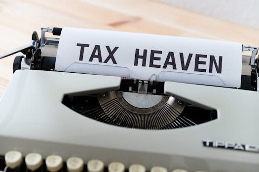 Close-up of a vintage typewriter displaying the words 'TAX HEAVEN', conveying a conceptual financial theme.