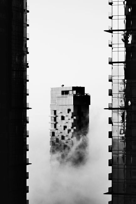 A stunning black and white image of Dubai skyscrapers enveloped in mist, highlighting urban elegance.
