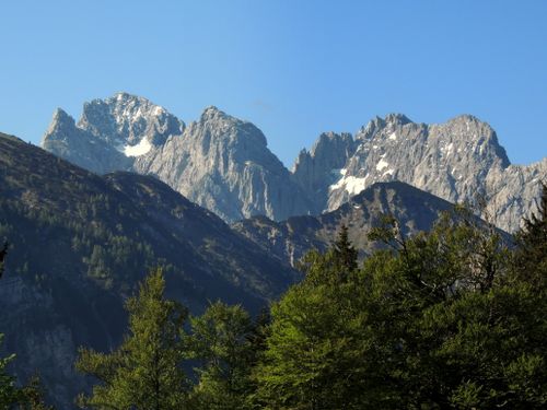 Free Explore the majestic mountain peaks of Walchsee, Tirol, against a clear blue sky. Stock Photo