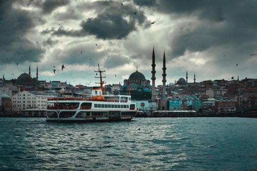 Boat floating on river in old city on overcast day