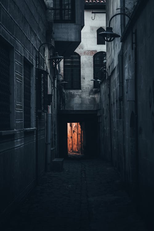 Narrow passage between aged buildings in town