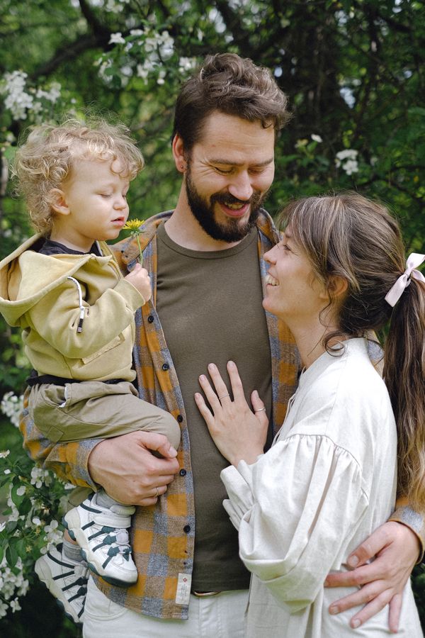 A happy family posing in a spring garden
