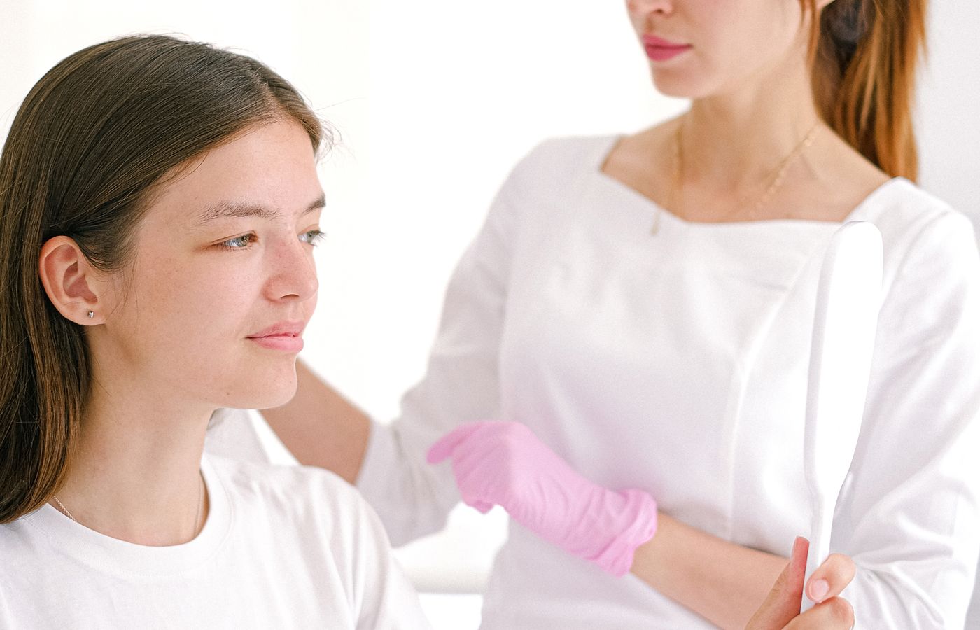 Patient discussing skincare results during a clinic consultation