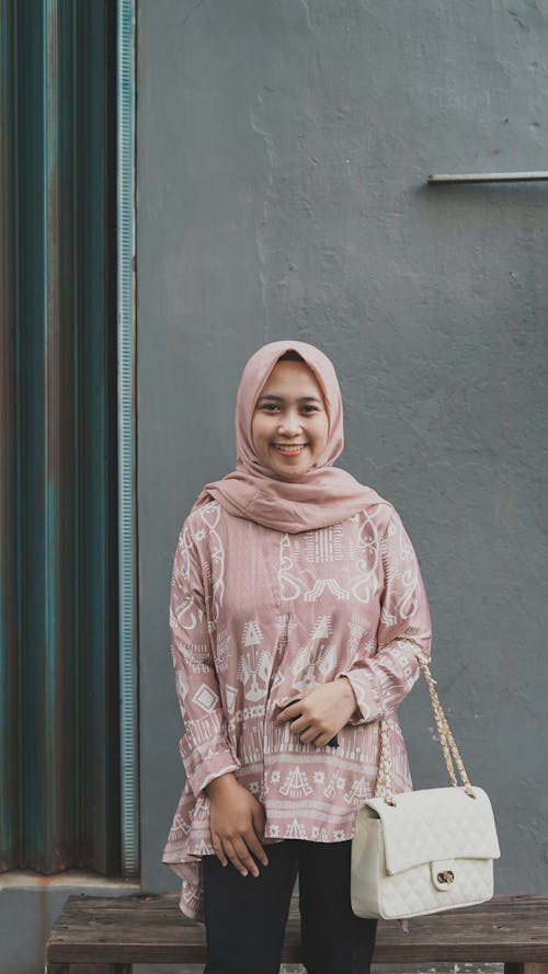 A Woman with Hijab and White Shoulder Bag