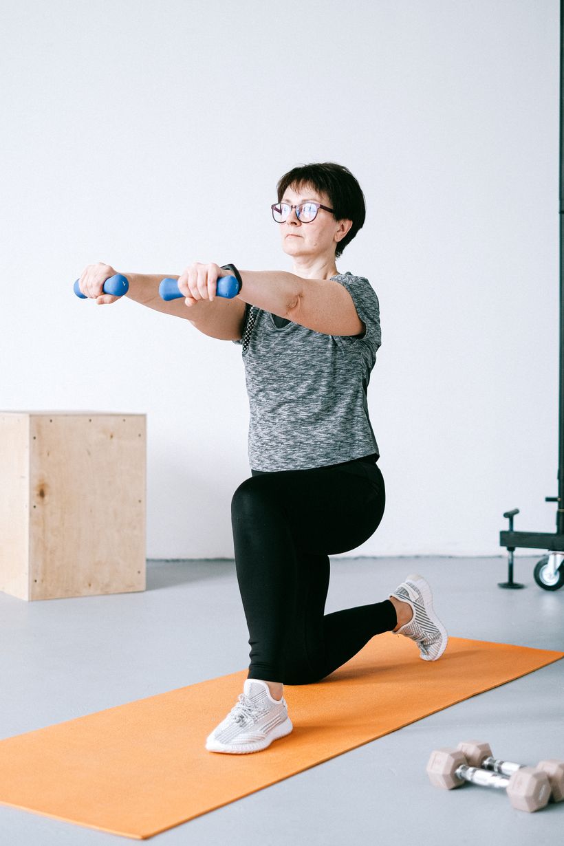 Person checking a fitness tracker while exercising