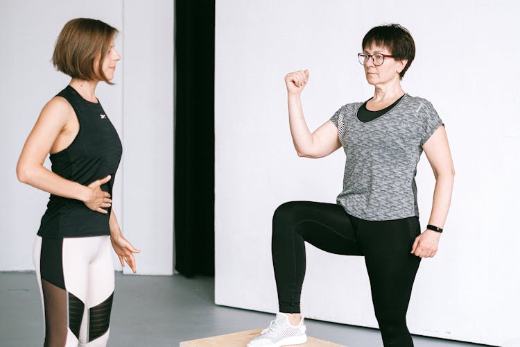 Women Exercising At Fitness Class