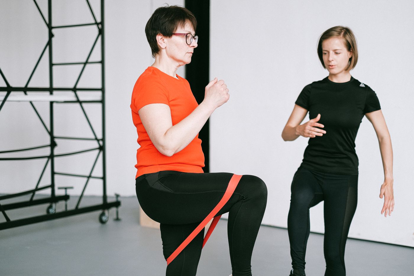 Personal fitness coaching session with resistance bands