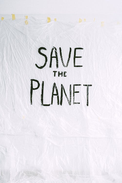 Save The Planet Text on White Textile