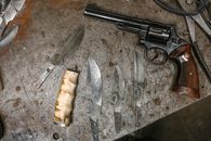 Silver Revolver on Gray Textile