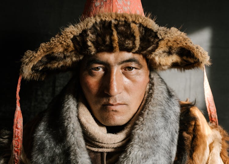 Man In Traditional Far East Hat Of Steppe People