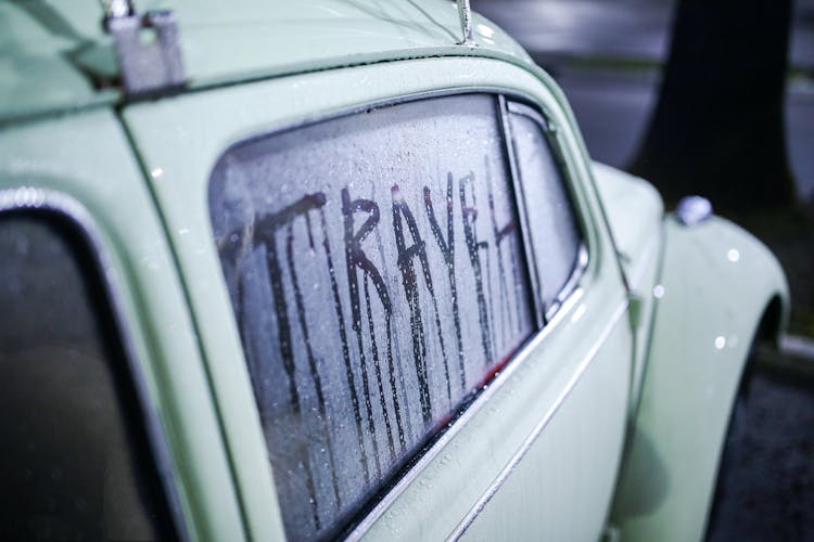 Word Travel Written On Foggy Window Of Vintage Car